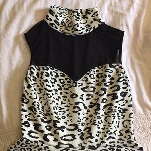 This is a black and white animal print peplum top